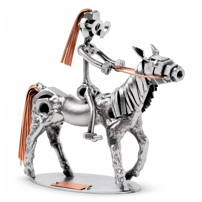 Handgemaakte Hinz & Kunst sculptuur van een meisje op pony met zadel, teugels en koperkleurige manen. Ca. 13 x 18 x 15 cm.