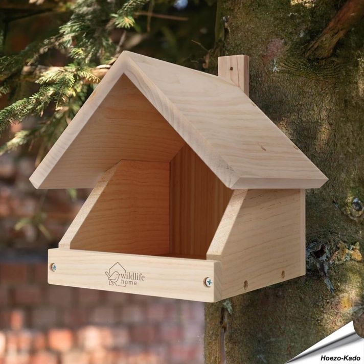 Merels in de nestkast. Nestkast halfholten voor merels in vogeltuin - Hoezo-Kado